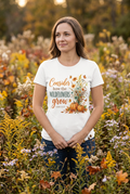 Woman wearing Consider How the Wildflowers Grow Tee in autumn wildflower meadow