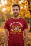 White man wearing I Trust the Next Chapter Tee in deep red